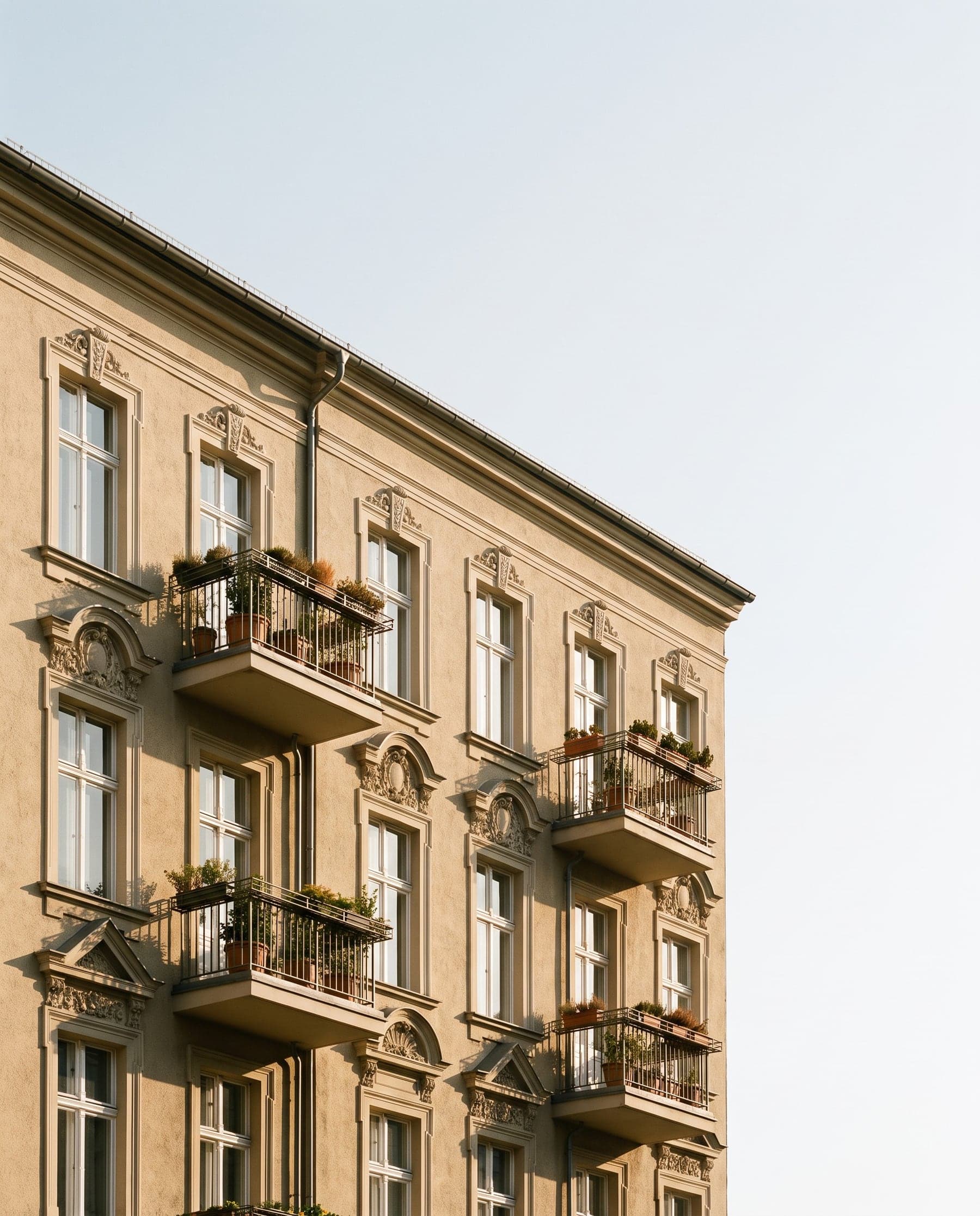 Restored period façade with balconies in the evening light (AI-generated mood image)